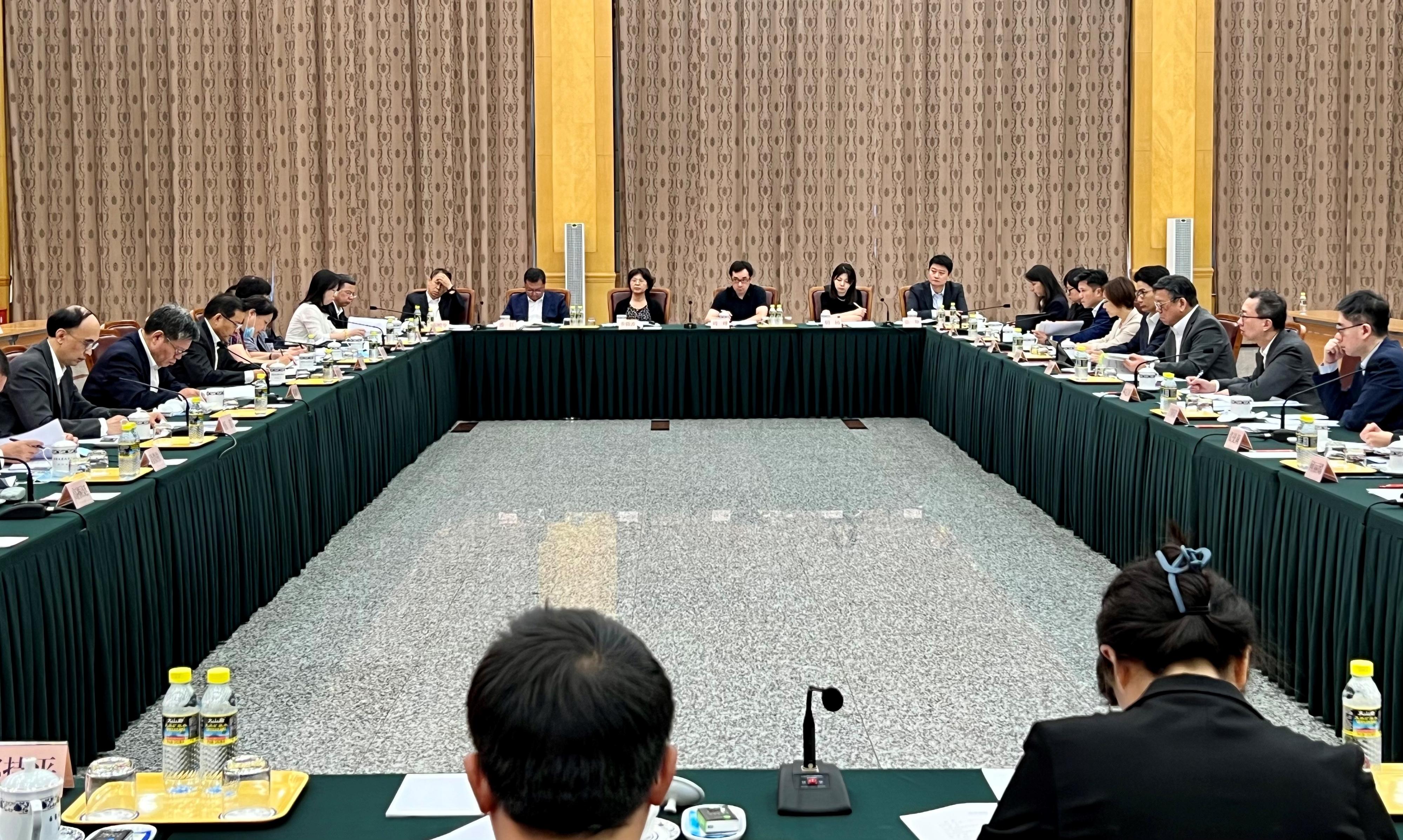 The Government of the Hong Kong Special Administrative Region (HKSAR), the National Development and Reform Commission (NDRC) and relevant Mainland ministries held the sixth Joint Conference on Advancing Hong Kong's Full Participation in and Contribution to the Belt and Road Initiative in Beijing today (July 19). Photo shows Member of the CPC Leadership Group of the NDRC Mr Guo Lanfeng (second left); the Secretary General of the NDRC and Convenor of the Joint Conference, Mr Wu Hao (first left); the Secretary for Justice and chairperson of the Working Group on Belt and Road Development under the Steering Group on Integration into National Development, Mr Paul Lam, SC (second right); the Secretary for Commerce and Economic Development and Hong Kong-side Convenor of the Joint Conference, Mr Algernon Yau (third right); and other officials of the Mainland ministries and the HKSAR Government at the conference.